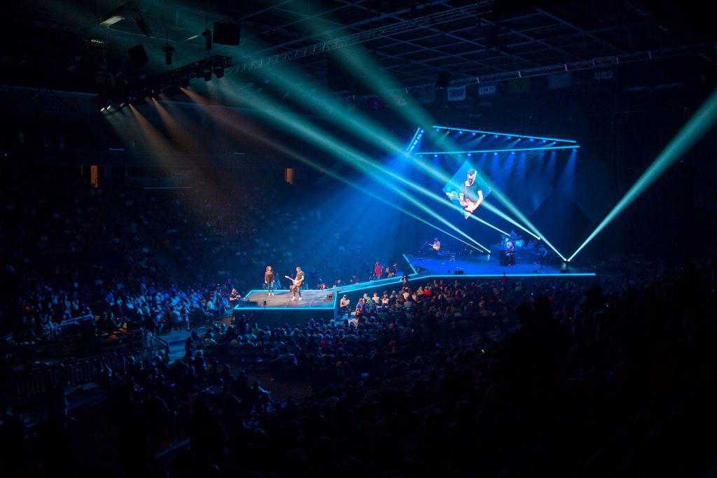 Band performing on stage in GCU Arena