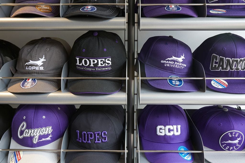 Racks with different GCU hats at the GCU Lope Shop