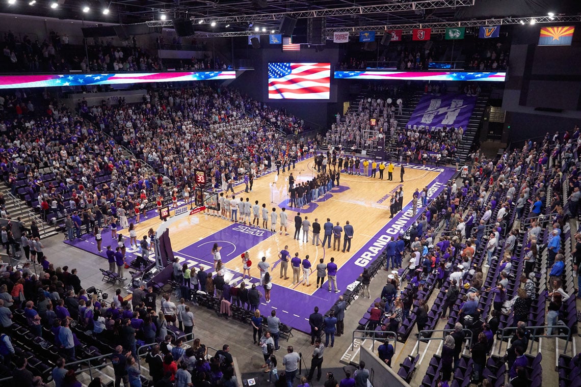 GCU Men's Basketball game standing at attention for the Star Spangle Banner